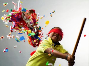 Boy smiling after hitting pinata