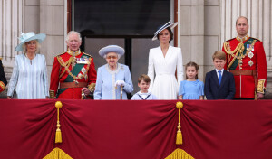 FILE PHOTO: Britain's Queen Elizabeth, Prince Charles, Camilla, Duchess of Cornwall, Prince William and Catherine, Duchess of Cambridge, along with Princess Charlotte, Prince George and Prince Louis appear on the balcony of Buckingham Palace as part of Trooping the Colour parade during the Queen's Platinum Jubilee celebrations in London, Britain, June 2, 2022. Ian Vogler/Pool via REUTERS/File Photo