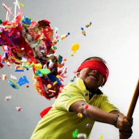 Boy smiling after hitting pinata