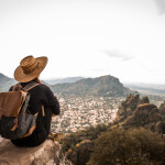 Argentinian woman traveling Mexico. She is enjoying the view on Tepoztlan, Mexico